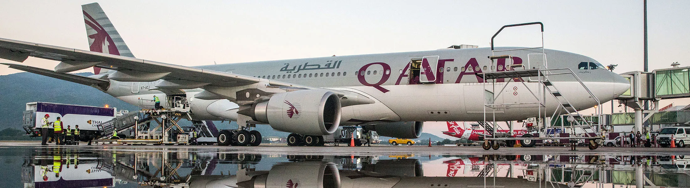 Ground Staff unload a Qatar Airways Ltd. aircraft parked at Chiang Mai International Airport in Chiang Mai, Thailand, on Wednesday, Dec. 13, 2017. Qatar Airways launched its new direct service from Doha to Chiang Mai today. The new seasonal service will operate 4 times a week with a flight time of just over six hours. Photograph: Taylor Weidman/Bloomberg