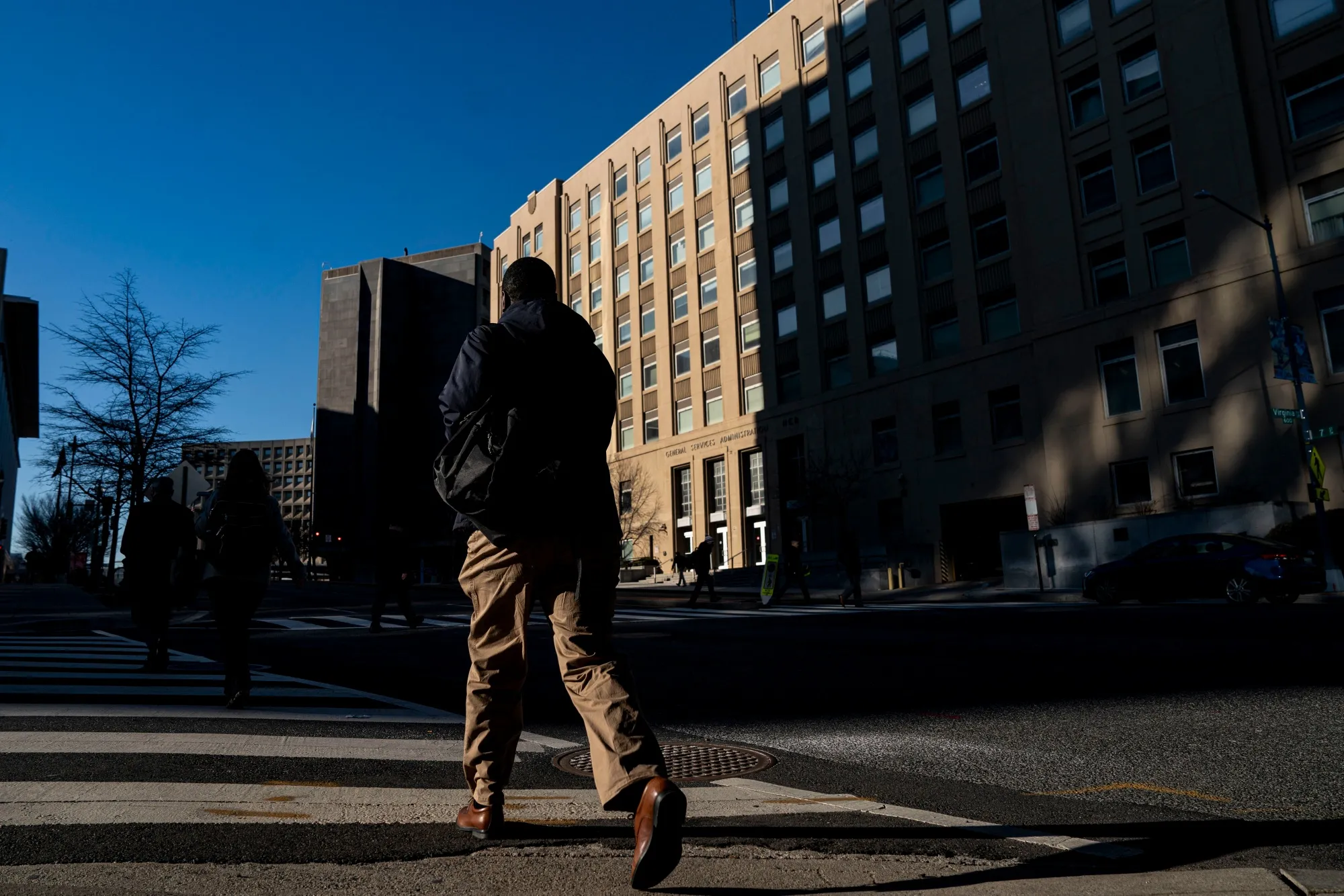 A commuter near a General Services Administration building in Washington, DC.