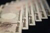 Japanese 10000 yen notes are displayed for a photograph in Tokyo, Japan.