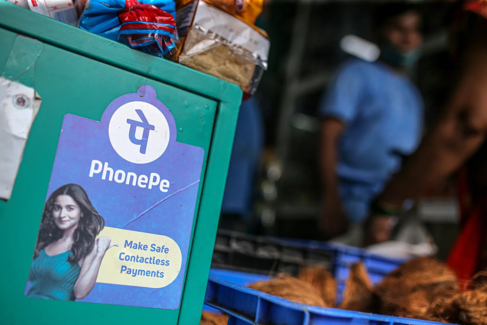 A general store advertises the use of the PhonePe digital payment system in Mumbai, India.