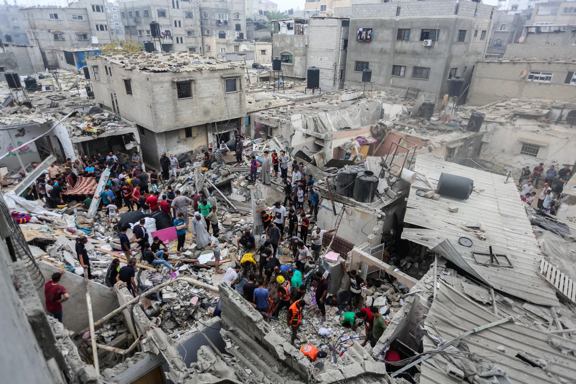 People search through buildings&nbsp;destroyed during Israeli air raids in the southern Gaza Strip on Oct.&nbsp;29.