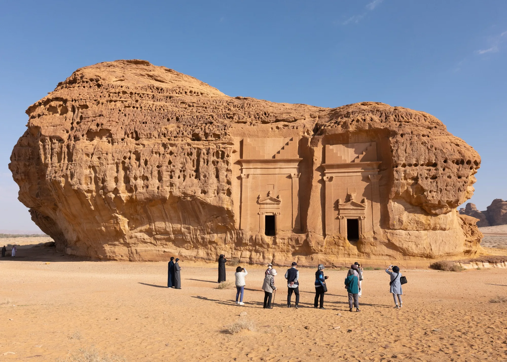 Tourists during a visit to the ancient archaeological site of Hegra in AlUla, Saudi Arabia.