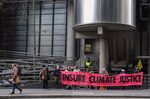 Climate activists from Extinction Rebellion outside the Lloyd's of London building.