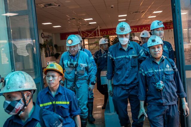 Japanese and Vietnamese workers enter the mine shaft elevator at Ha Lam Coal Mine in Cam Pha, Quang Ninh Province, Vietnam, on Tuesday, July 11, 2023. Photographer: Linh Pham/Bloomberg