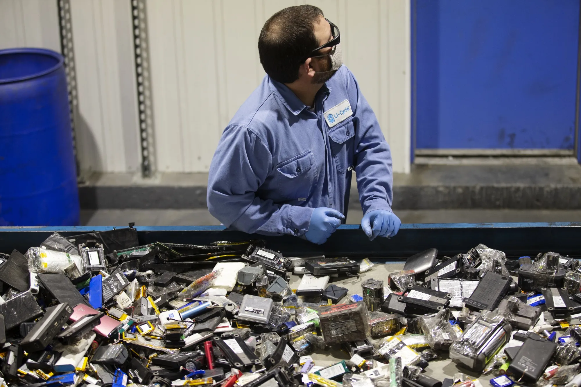 A worker&nbsp;sorts batteries at the Li-Cycle lithium-ion battery recycling facility in Kingston, Ontario.&nbsp;