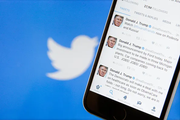 The Twitter app is seen on various digital devices on March 28, 2018.
