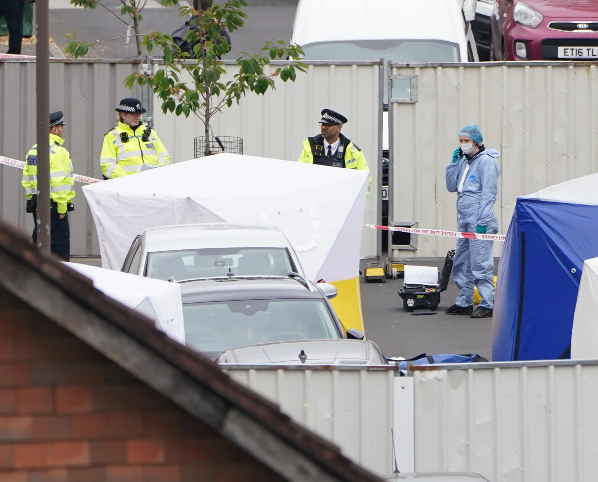 Police forensic tents outside a house in Bermondsey, London, after three women and a man were stabbed to death in the early hours of Monday.