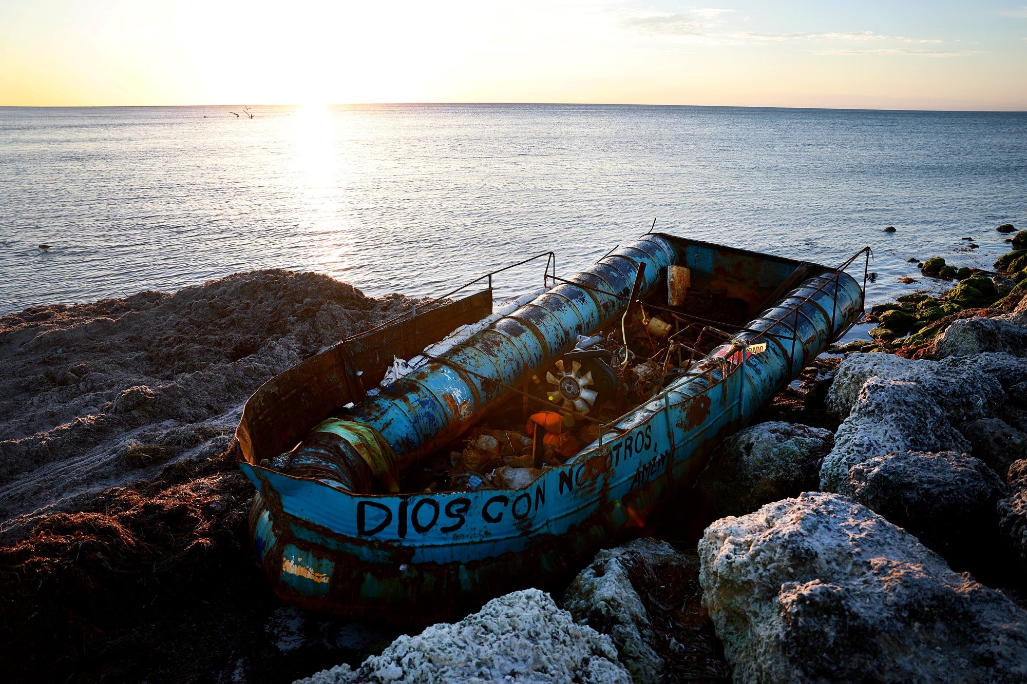 KEY WEST, FLORIDA - JANUARY 06: A boat that was left along the shoreline after it was used recently to transport Cuban migrants from the island nation to America on January 06, 2023 in Key West, Florida. An increasing number of migrants from Cuba and Haiti have been taking to the seas to reach the United States. (Photo by Joe Raedle/Getty Images) Photographer: Joe Raedle/Getty Images