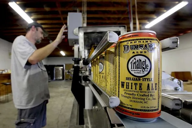 Testing canning equipment at Triangle Brewery in Durham, N.C.