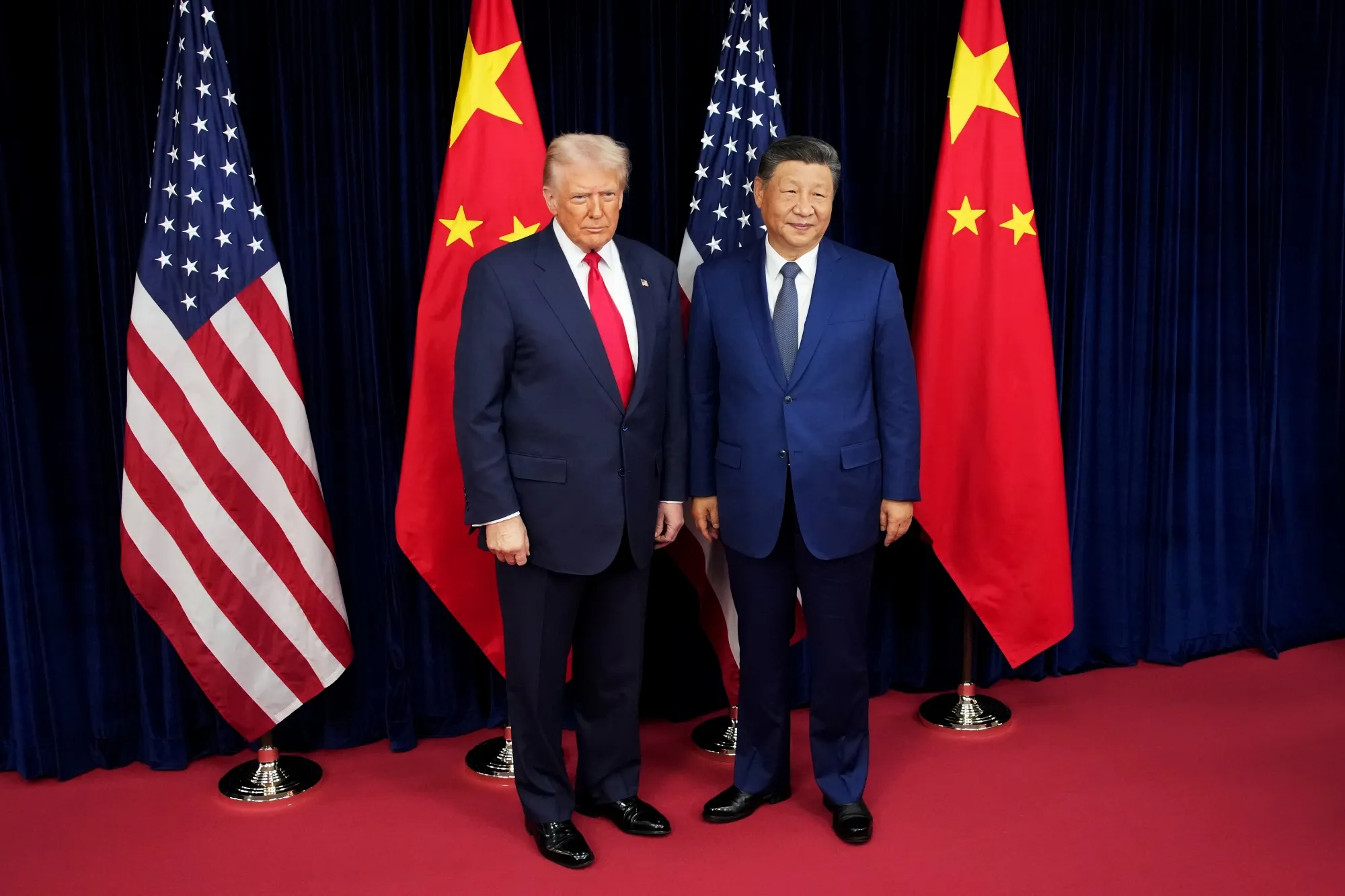 US President Donald Trump and Chinese President Xi Jinping in Busan, South Korea, today. 