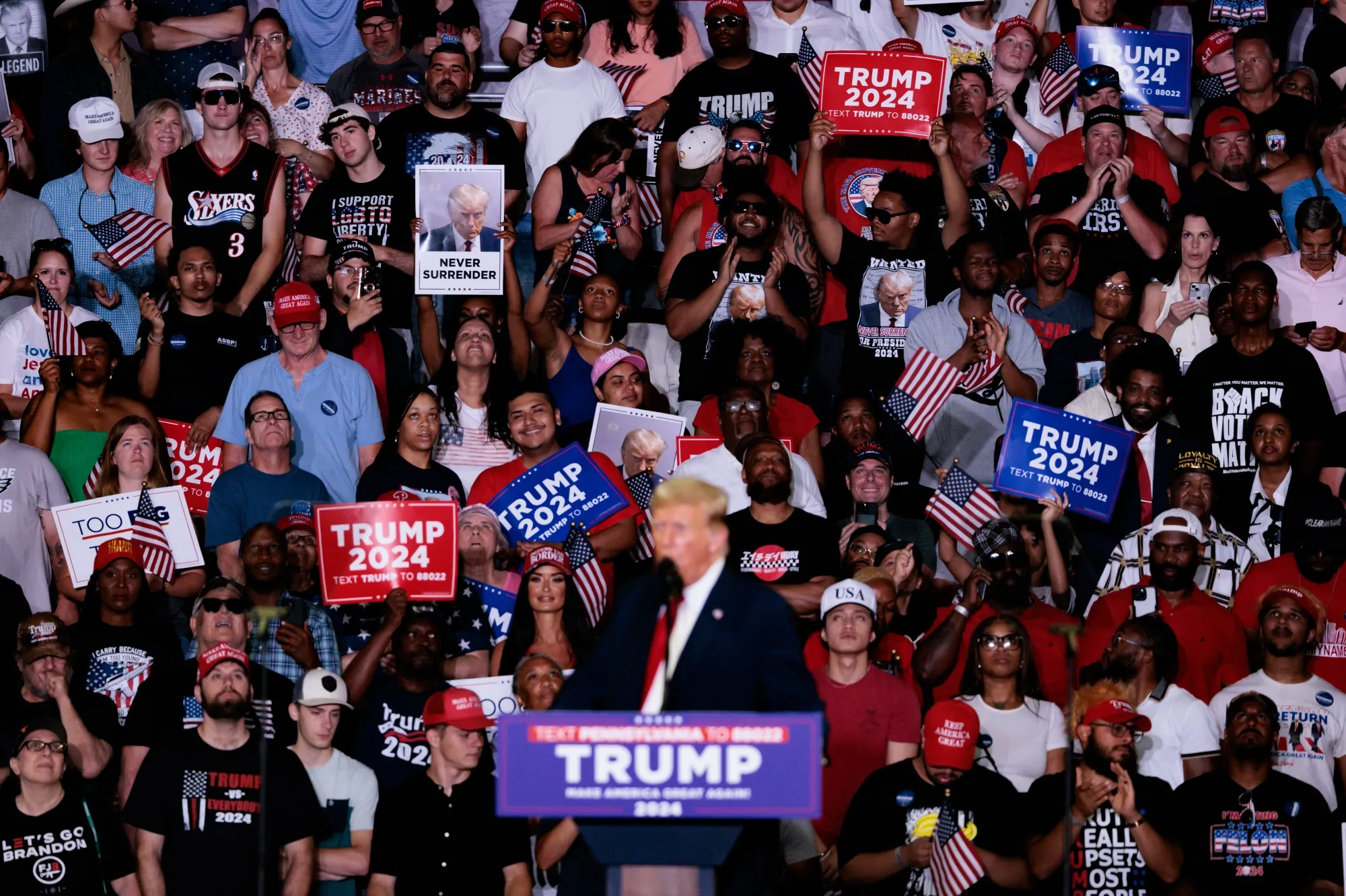 Attendees listen as former US President Donald Trump speaks during a campaign event at the Liacouras Center at Temple University in Philadelphia, Pennsylvania, US, on Saturday, June 22, 2024. 