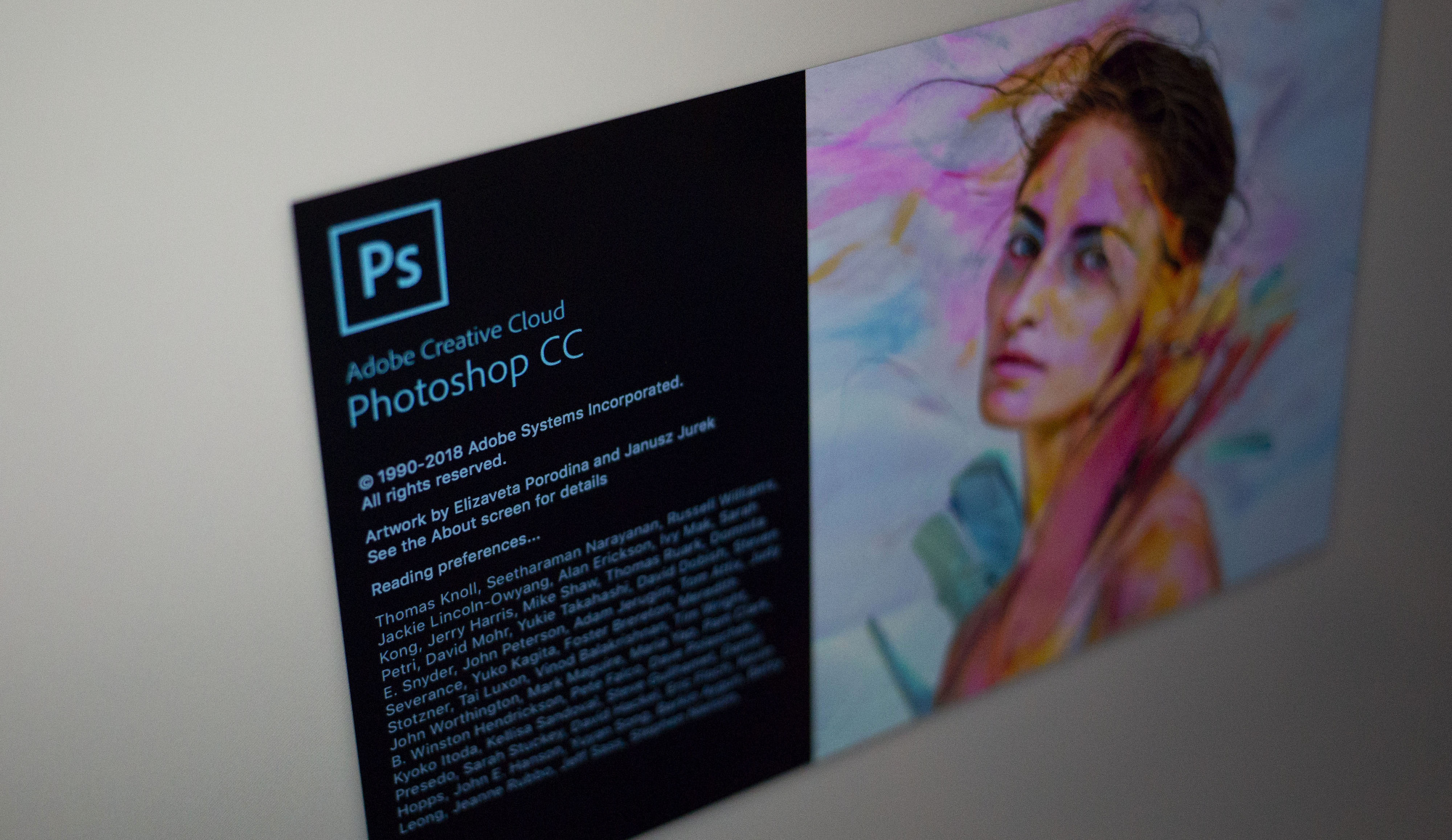 The Adobe Systems Inc. Photoshop CC software start-up screen is displayed on a computer monitor.