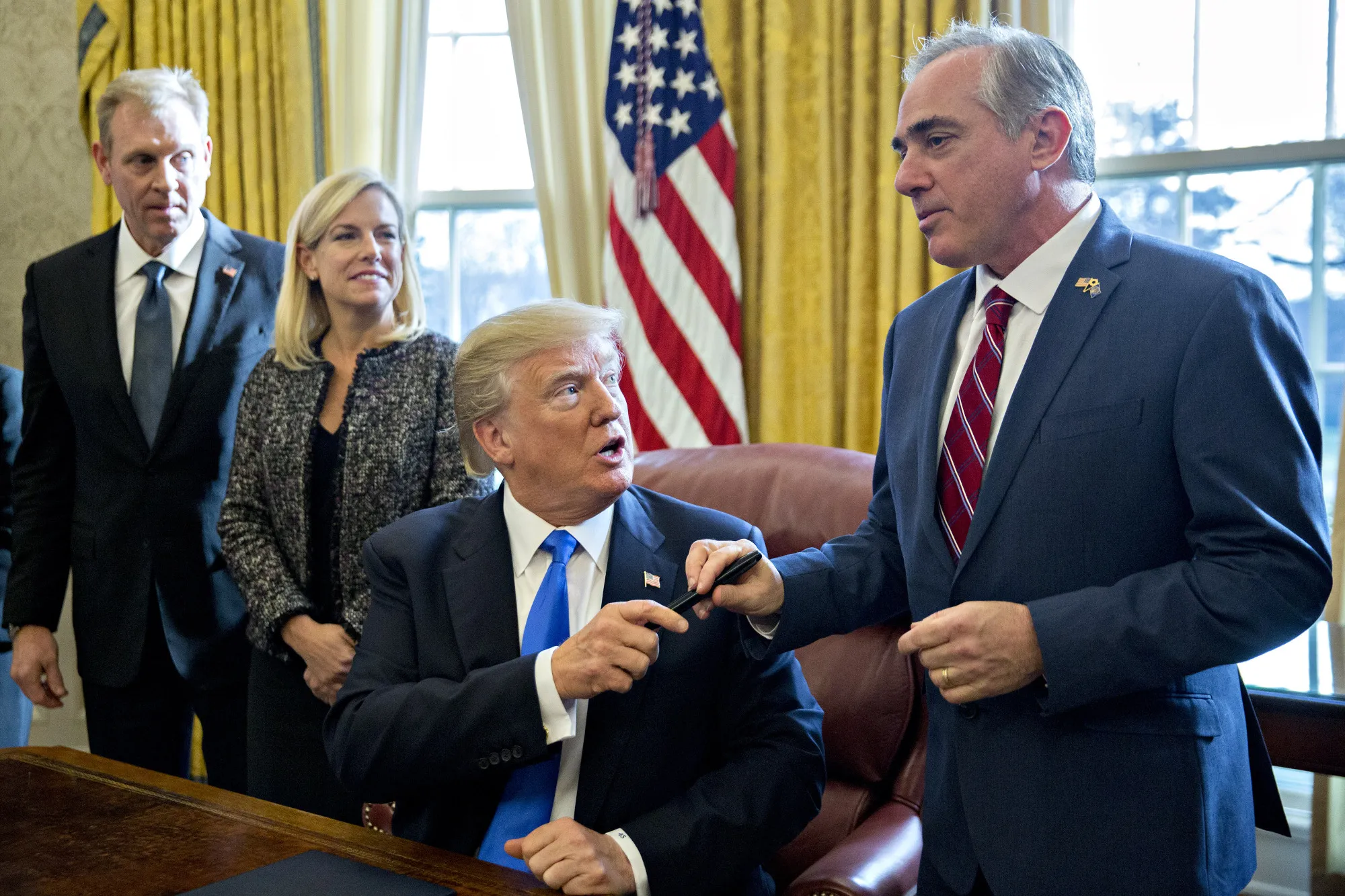 Trump and David Shulkin, right.