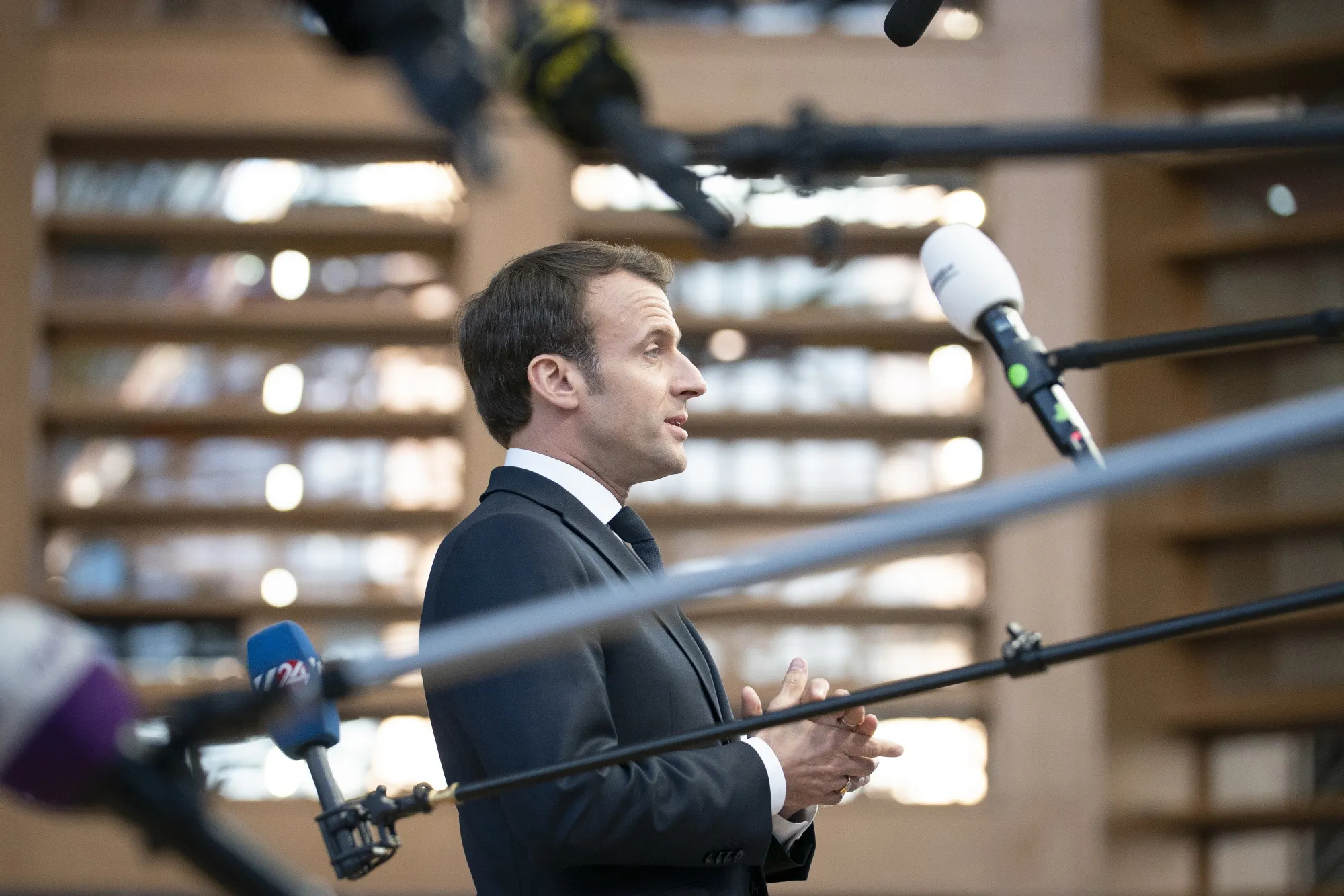 Macron speaks as he arrives for a European Union leaders summit in Brussels on April 10.