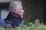 Former Wimbledon tennis champion Boris Becker looks back as he waits in a queue to get into Southwark Crown Court in London, Monday, March 21, 2022. Becker is in court accused of filing to hand over trophies from his glittering tennis career to settle debts, relating to charges over his bankruptcy. (AP Photo/Alastair Grant)