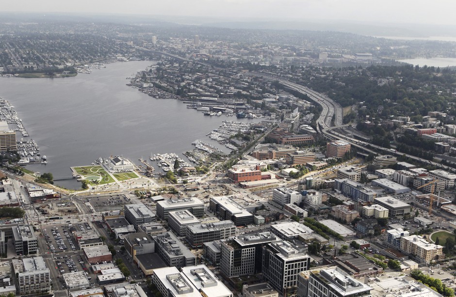 This aerial view looking north shows a portion of retail giant Amazon.com's corporate headquarters (bottom center and right) in the South Lake Union neighborhood of Seattle, Washington as seen from a helicopter in 2012.