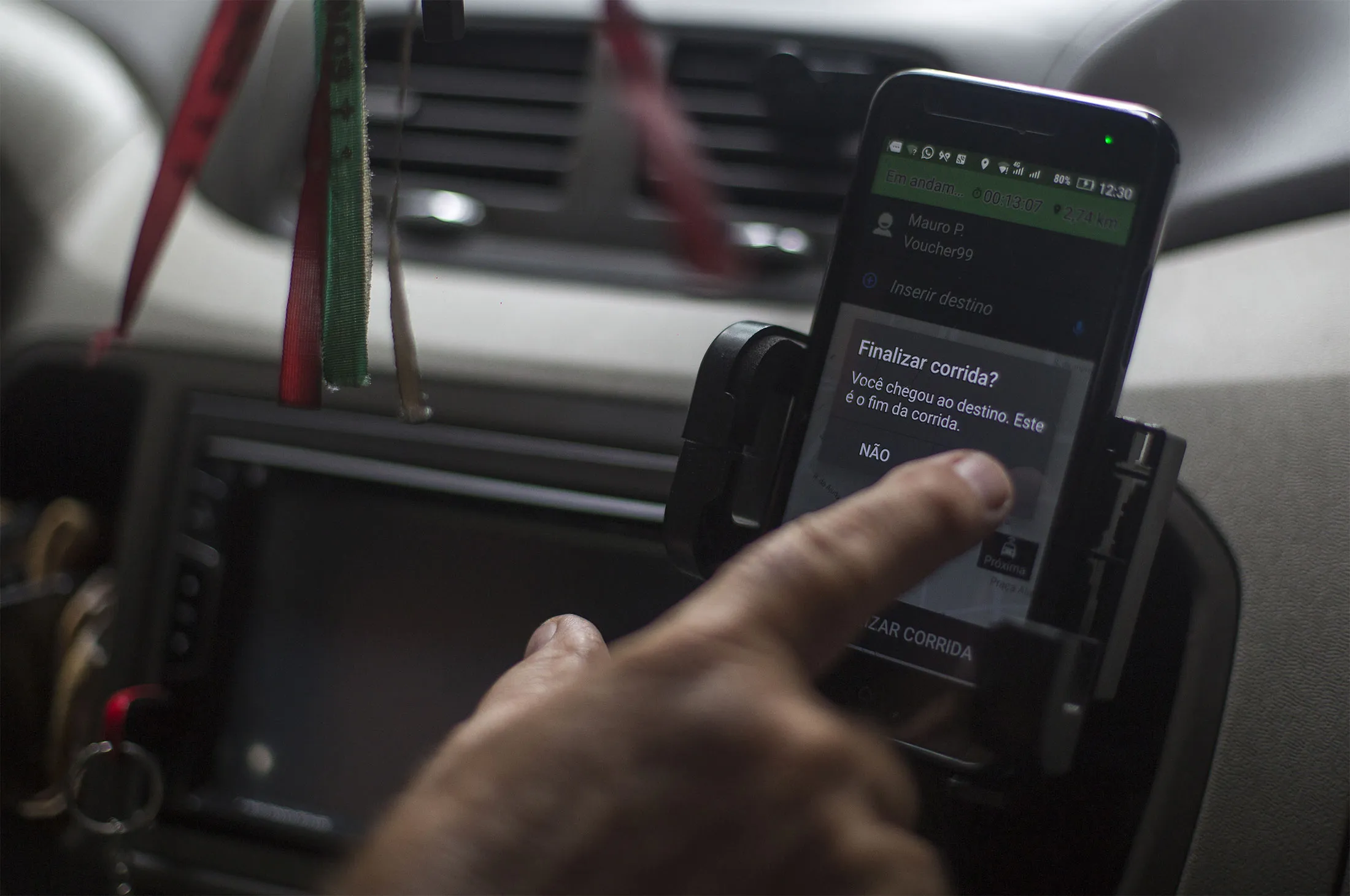 A driver ends a ride taken with the Brazilian&nbsp;ride-hailing app 99&nbsp;in Rio de Janeiro, Brazil, on Jan. 4.&nbsp;
