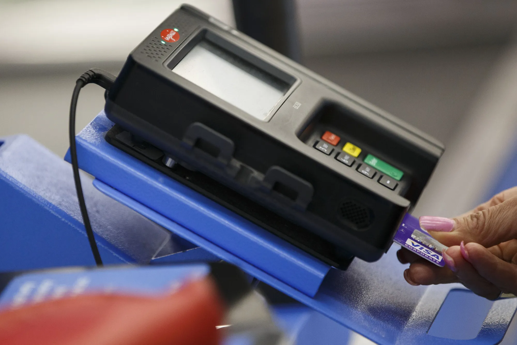 A customer uses credit card at a store.