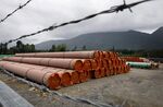 Pieces of the Trans Mountain Pipeline project sit in a storage lot outside of Hope, British Columbia, Canada, on June 6, 2021.