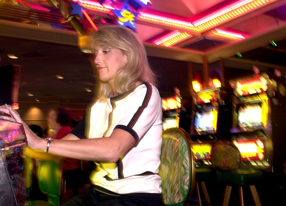 A woman plays the slot machines at Harrah's Casino in Tunica in 2002. The casino closed down in 2014. 