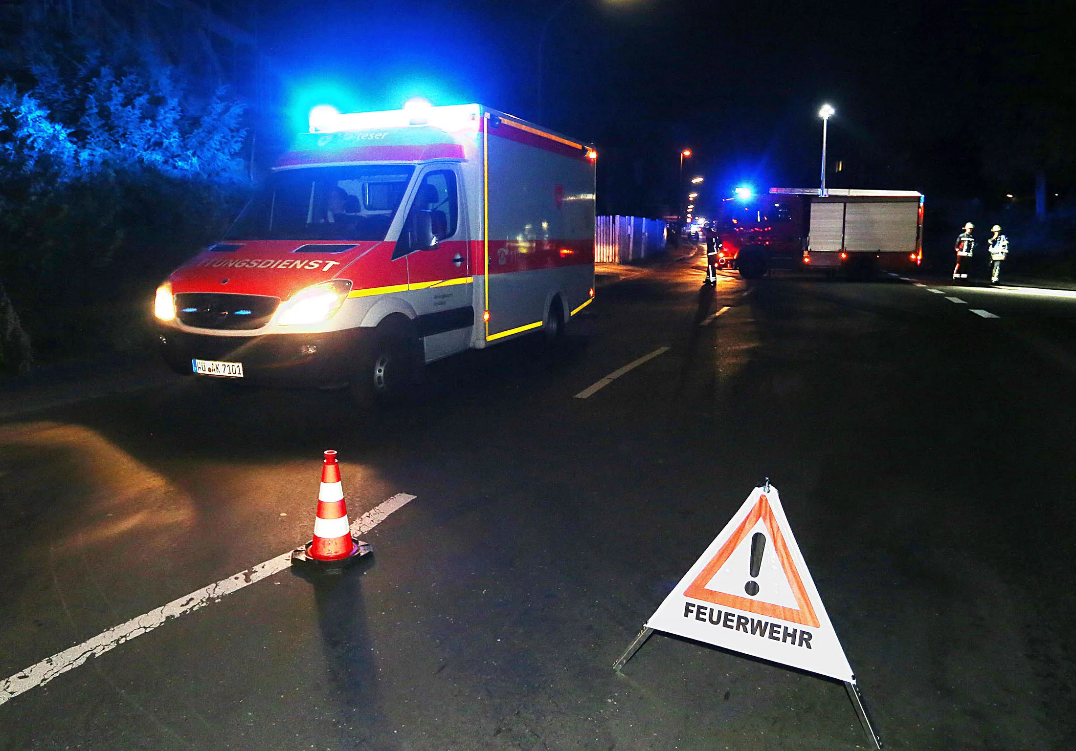 Rescuers gather near railtracks in southern Germany after a man attacked train passengers with an axe.
