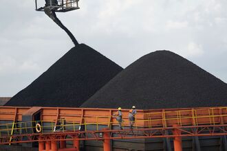 Coal is loaded onto a barge in East Kalimantan, Indonesia. 