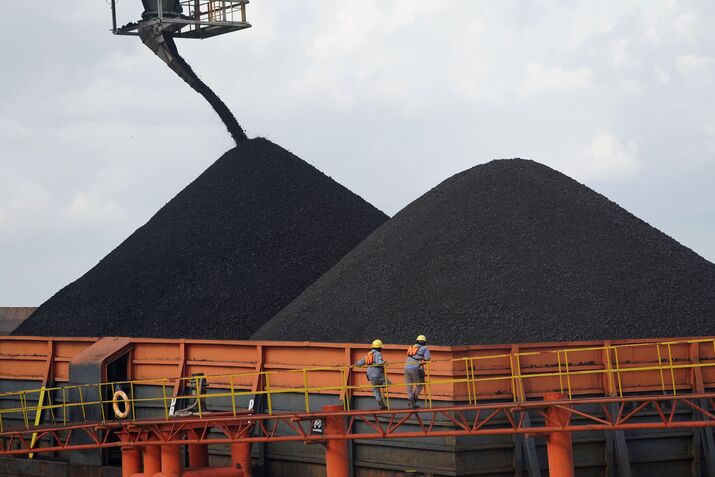 Coal is loaded onto a barge in East Kalimantan, Indonesia. 