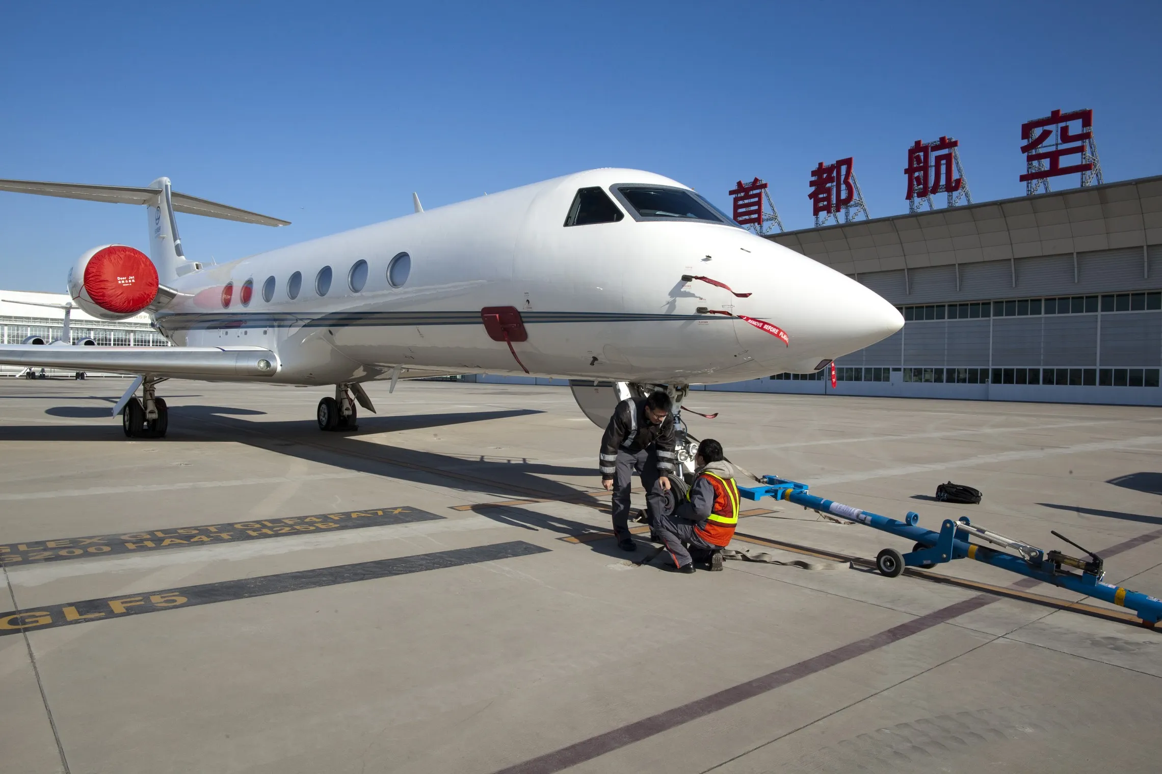 A Gulfstream Aerospace Corp. G550 stands near a Deer Jet Co. Ltd. hanger in Beijing in 2011.