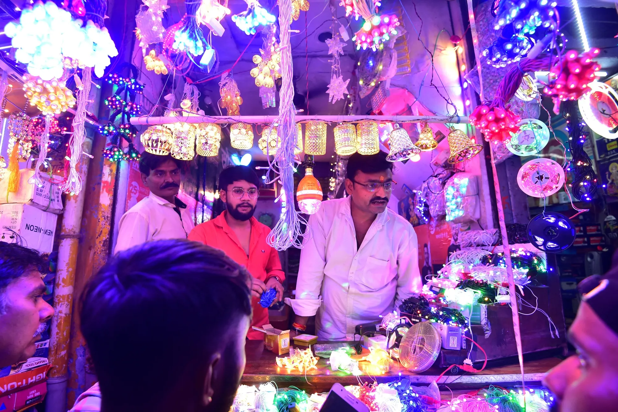 Shoppers buy decorative lights at a market in Allahabad on Oct. 20.