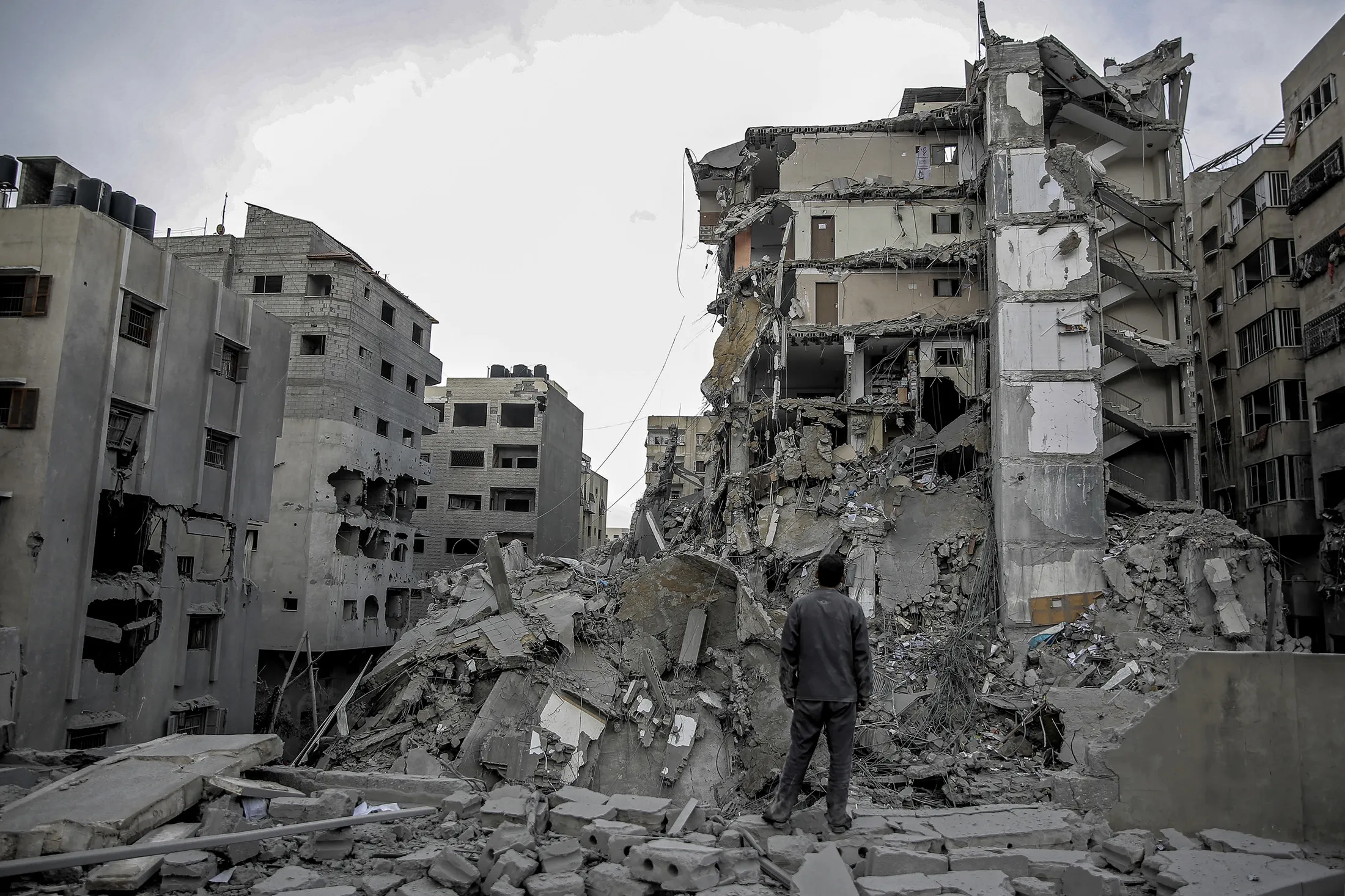 A Palestinian man stands amid the rubble of houses destroyed by Israeli bombardment in Gaza City on March 3.