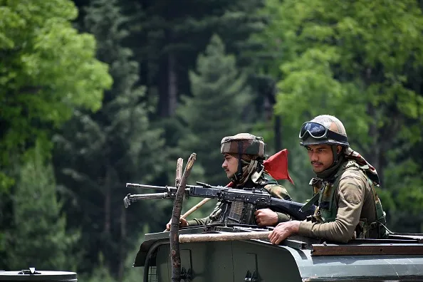 Indian army soldiers on top a military vehicle along the Srinagar-Leh National highway in 2020.