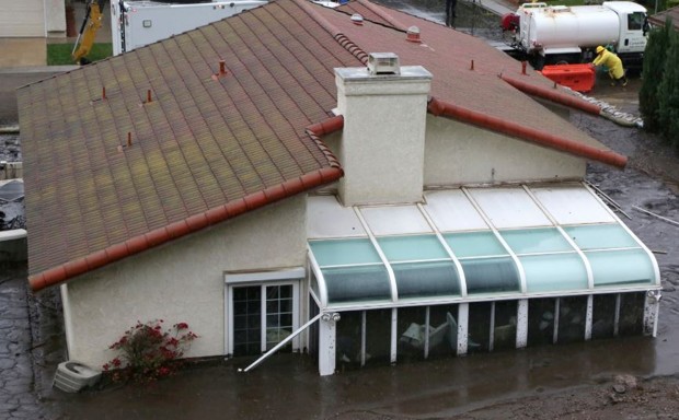 A house was mired in a mudslide during heavy rains on Tuesday in Camarillo, California.
