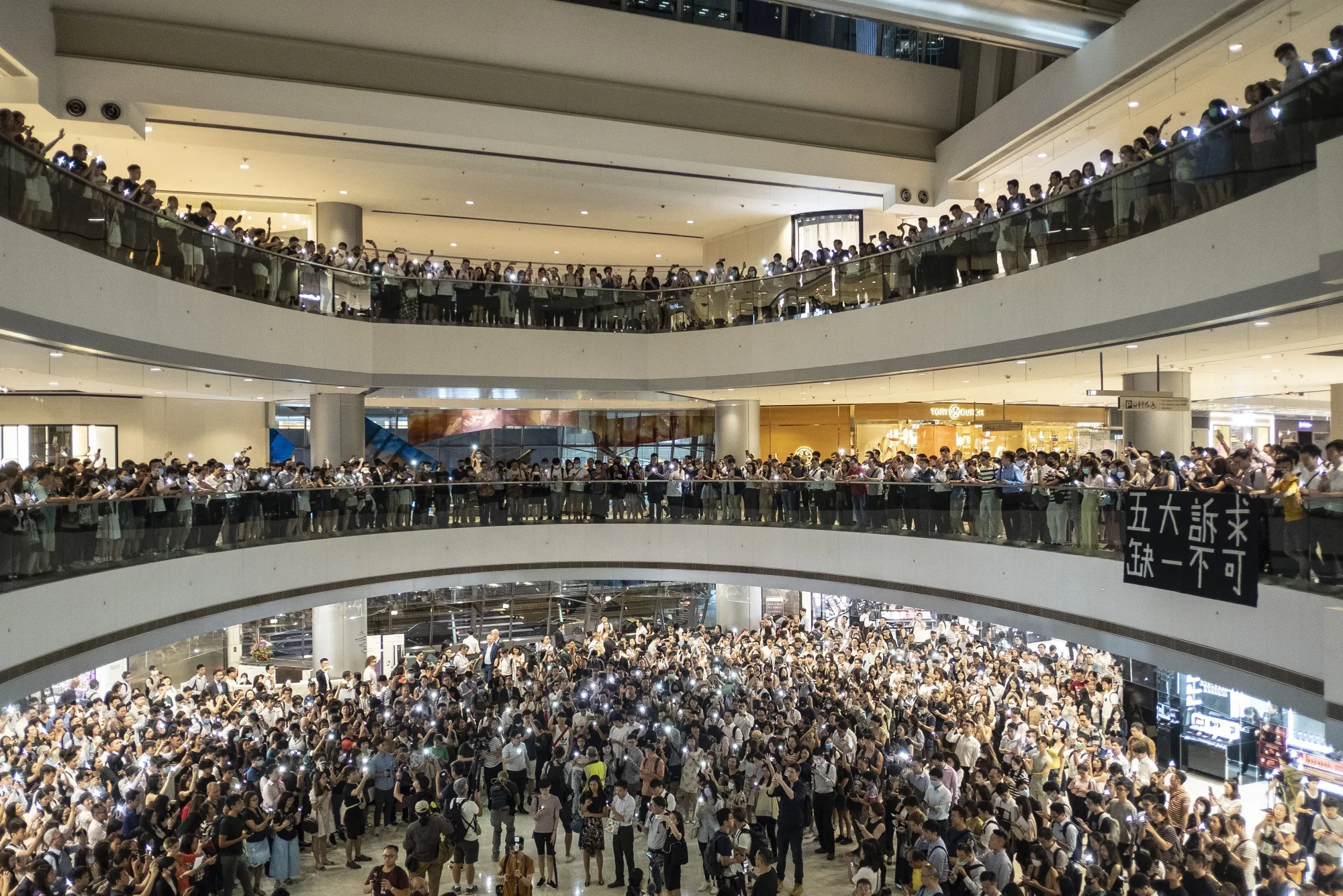 Demonstrators sing “Glory to Hong Kong” during a flash mob in Hong Kong in 2019.