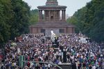 People gather at the Victory Column in the city center to hear speeches during a protest against coronavirus-related restrictions and government policy on Aug. 29.