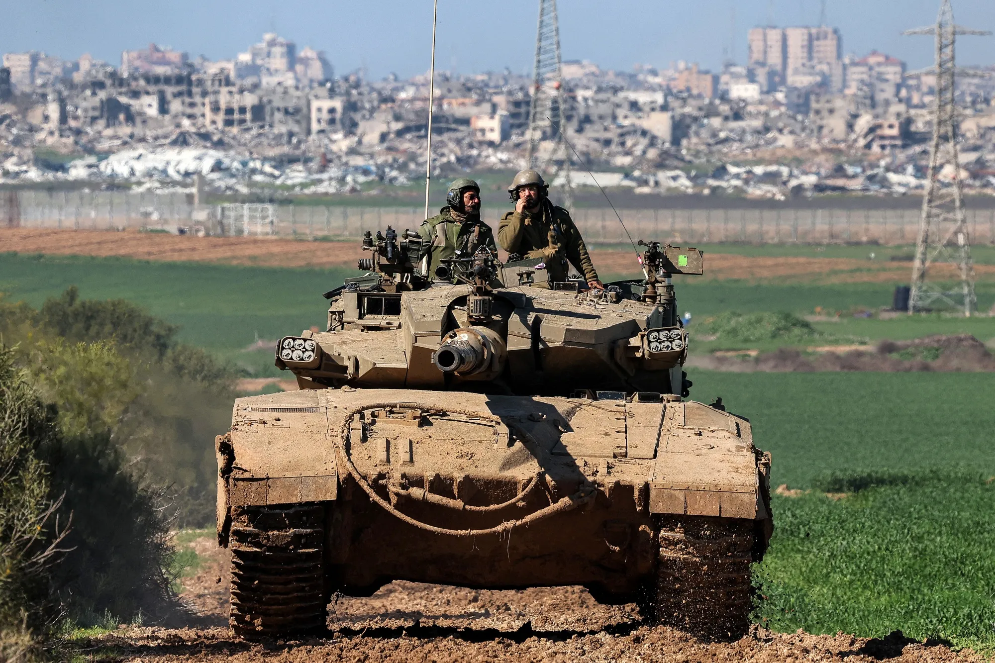 An Israeli army battle tank moves at a position along the border between southern Israeli and the Gaza Strip on Jan. 31.