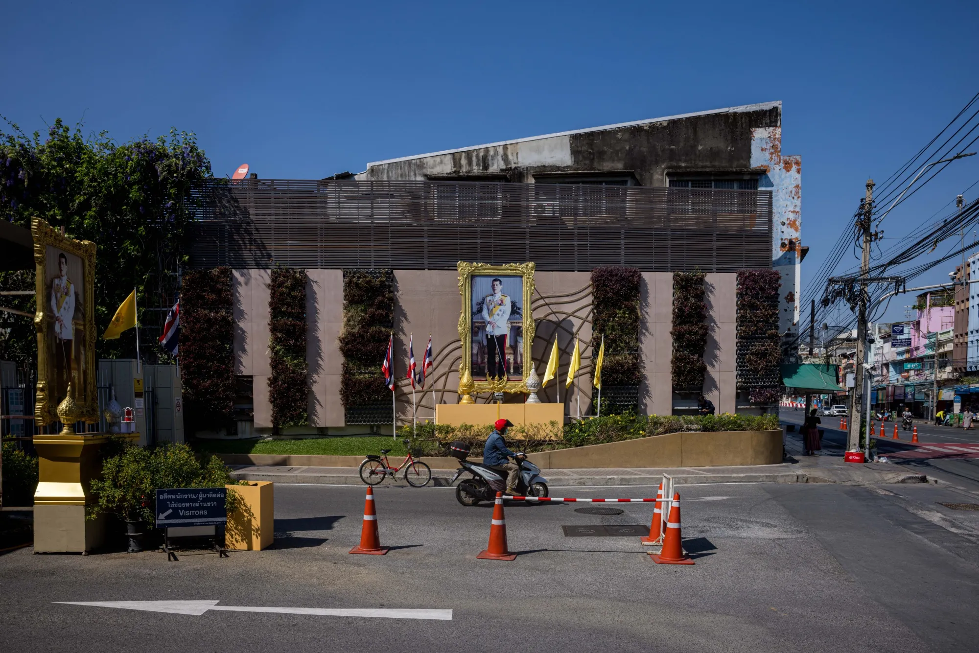 Portraits of King Vajiralongkorn outside an entrance to the Bank of Thailand complex in Bangkok.