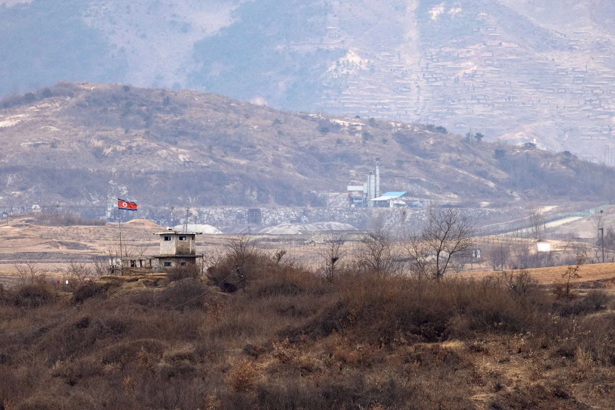 A North Korean flag flies at a military check point, from the truce village of Panmunjom in the Demilitarized Zone&nbsp;in Paju, South Korea.