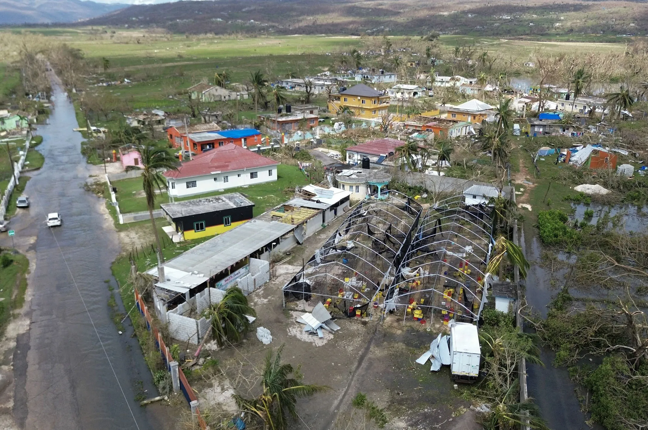 Flooding and damaged buildings&nbsp;in the aftermath of Hurricane Melissa in Lacovia, St Elizabeth, Jamaica, on October 31.
