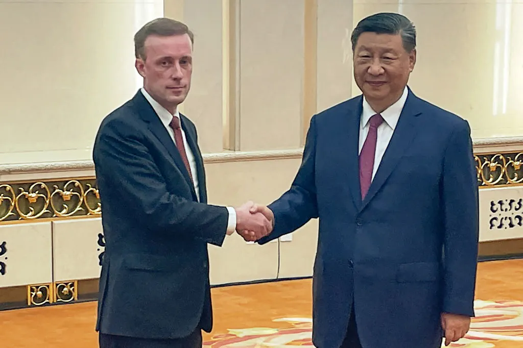 Jake Sullivan&nbsp;with Xi Jinping&nbsp;during their meeting.
