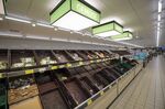 A few remaining vegetables sit in crates in the fresh produce aisle inside a&nbsp;supermarket in Hanau, Germany, on March 2.
