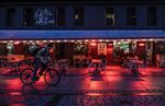 A cyclist passes a bar in&nbsp;Oslo on Sept. 23. Norway&nbsp;has so far reported almost 18,000 confirmed cases of coronavirus and 279 fatalities.