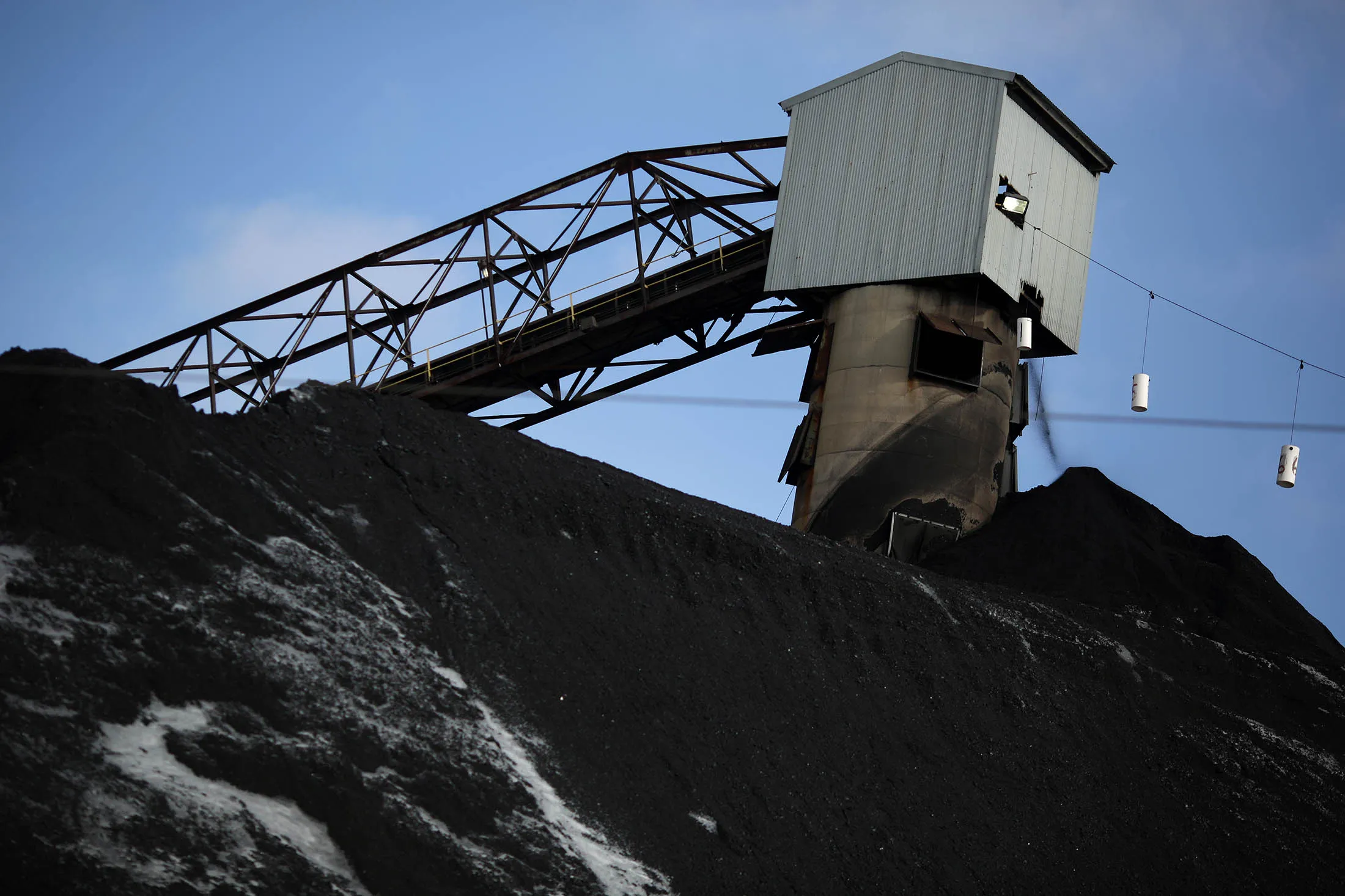 A coaling tower stands above a mound of coal at the Arch Coal Inc. Sentinel Prep Plant in Philippi, West Virginia, U.S., on Wednesday, Jan. 13, 2016. Arch, the St. Louis-based holder of the second-largest reserve of coal in the U.S., filed for creditor protection Monday, with an agreement to erase $4.5 billion in debt.
