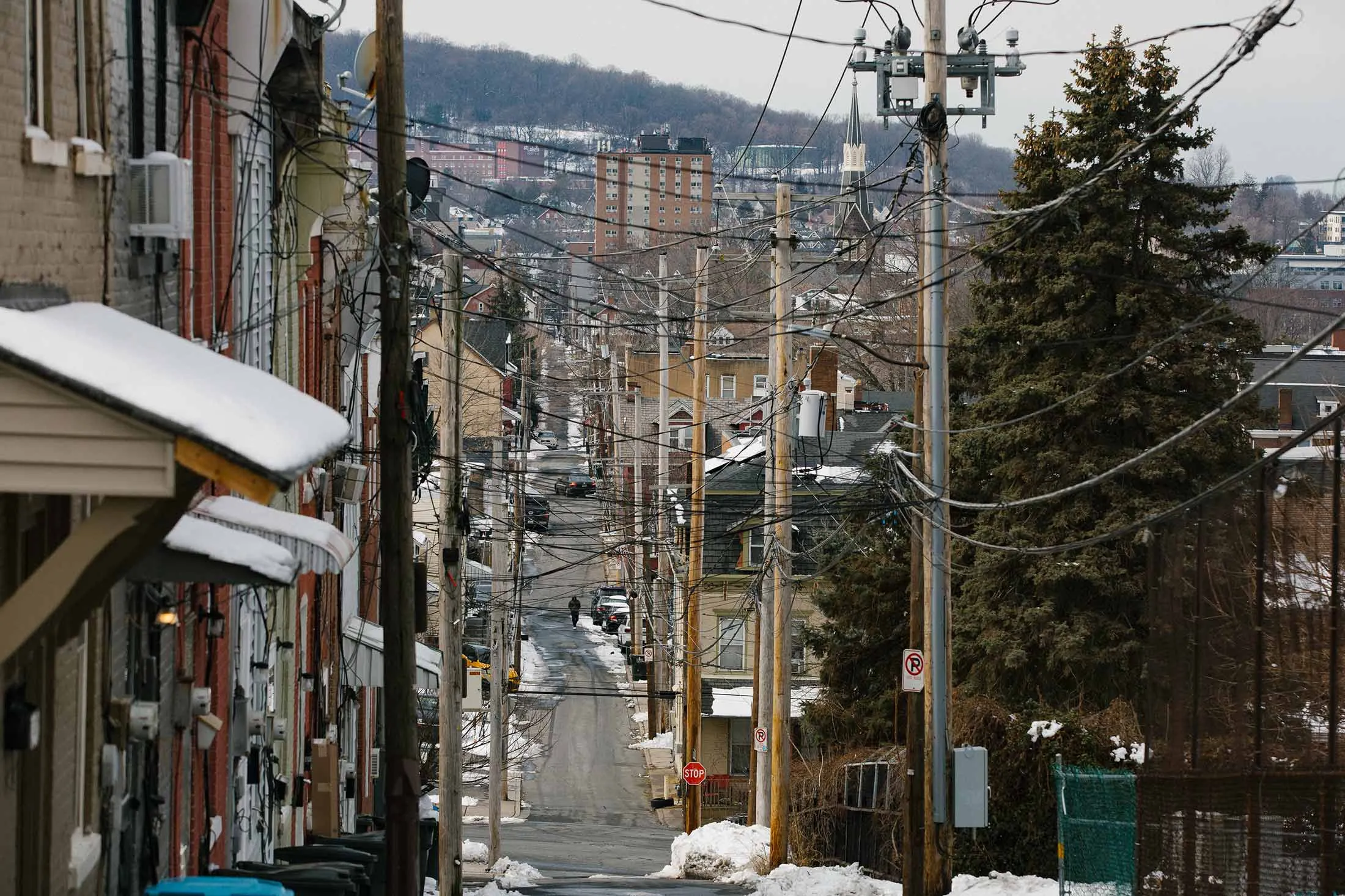 A row of utility poles are seen in a residential neighborhood in Bethlehem, Pennsylvania on Wednesday, February 25, 2026. The rising costs of energy and utility bills, particularly in the Lehigh Valley, could become central for voters in the upcoming midterm elections.  Photographer: Michelle Gustafson for Bloomberg Markets
