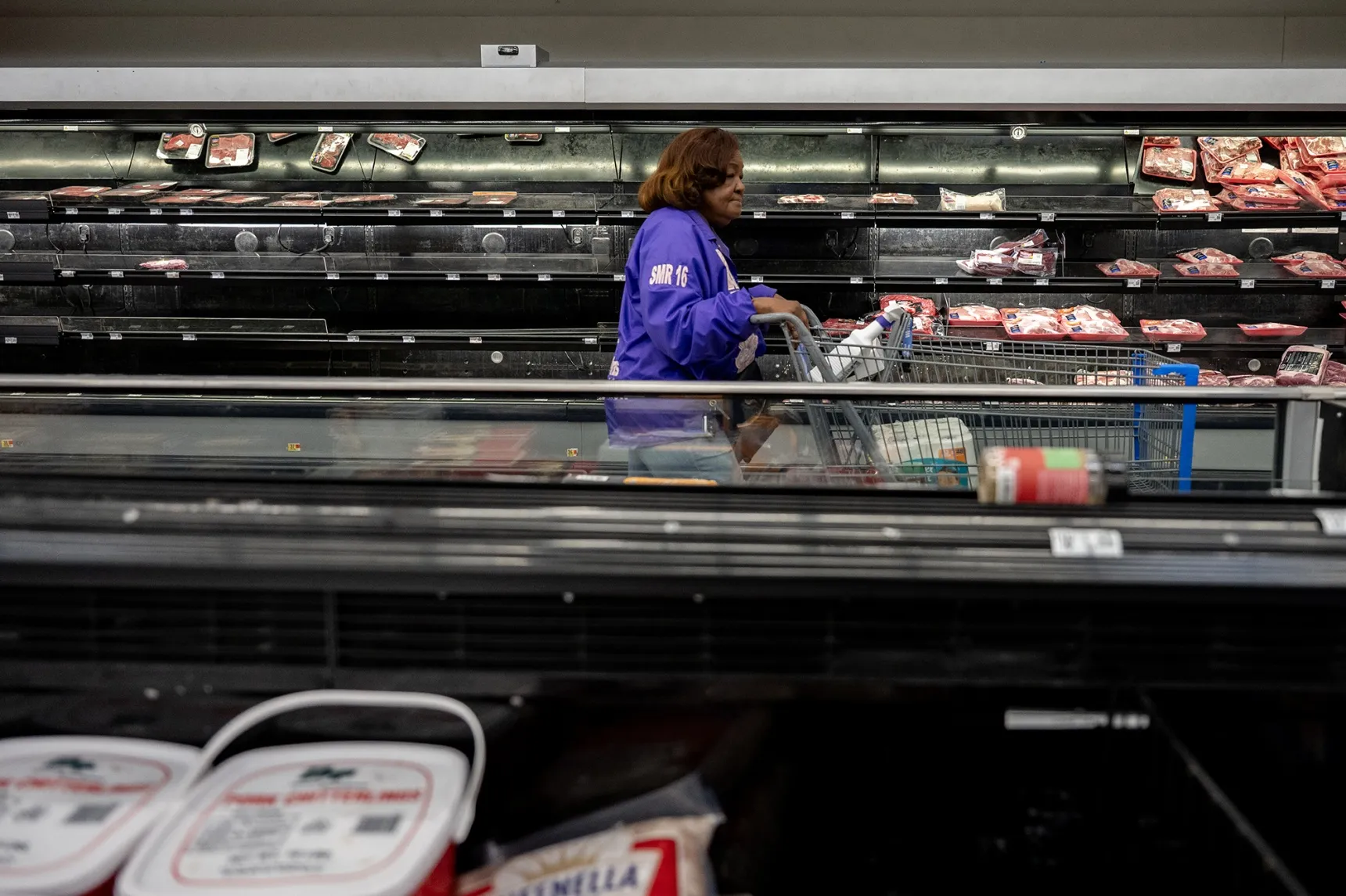 A customer walks past empty shelves at Walmart&nbsp;in Little Rock, Arkansas on Jan 23.&nbsp;
