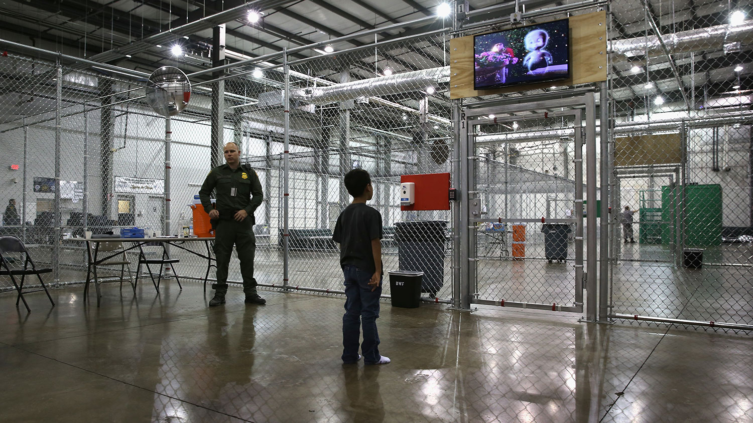 A boy from Honduras watches a movie at a detention facility run by the U.S. Border Patrol on Sept. 8, 2014, in McAllen, Texas.
