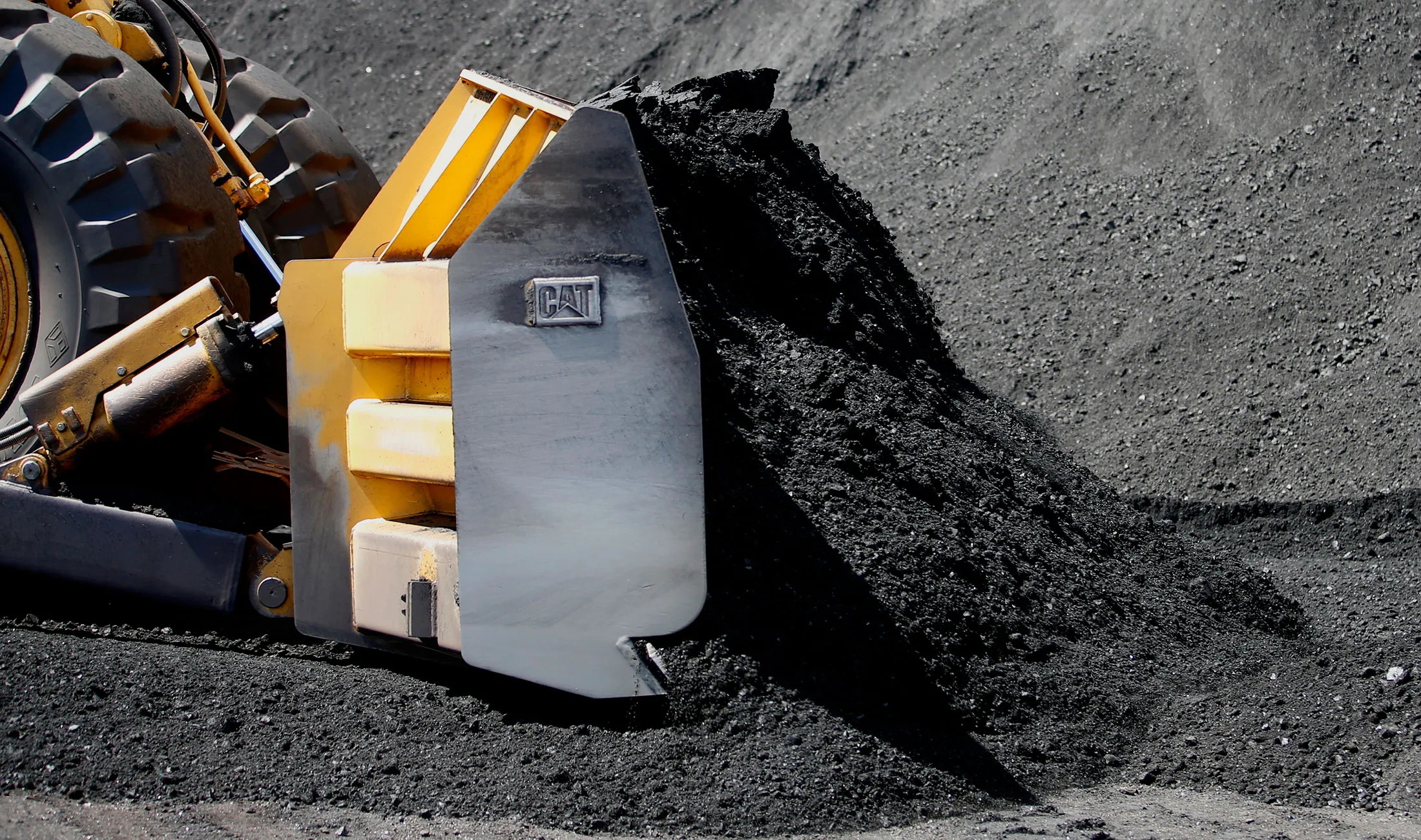 A Caterpillar Inc. 834B dozer moves coal at the Savage Industries Co. processing facility in Price, Utah, on Friday, May 27, 2016. Power-plant demand for gas has been breaking seasonal records amid low prices and a record shutdown of coal plants last year to meet stricter environmental regulations, government data show.
