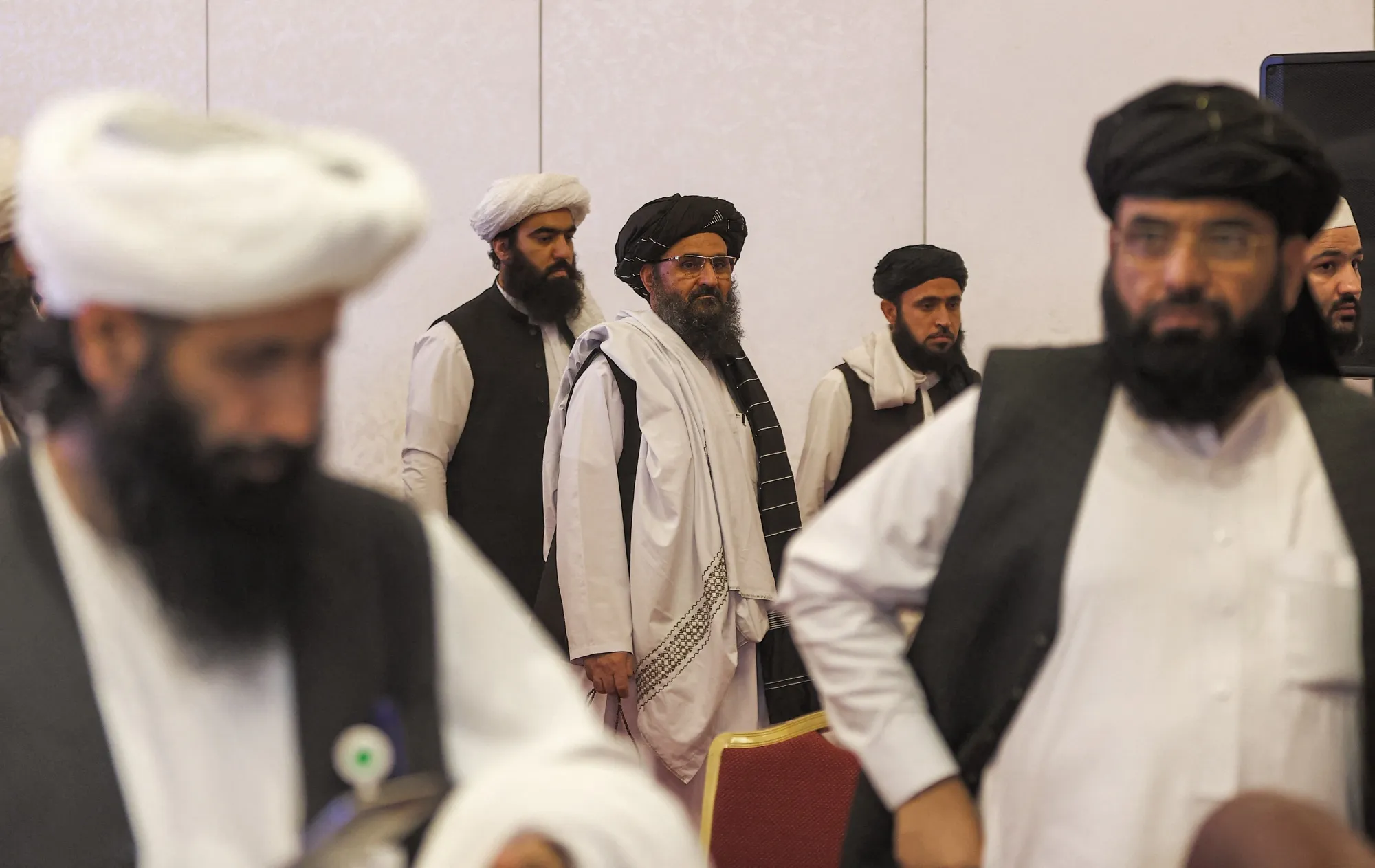 Mullah Abdul Ghani Baradar (center)&nbsp;in Qatar's capital Doha on July 18, 2021.