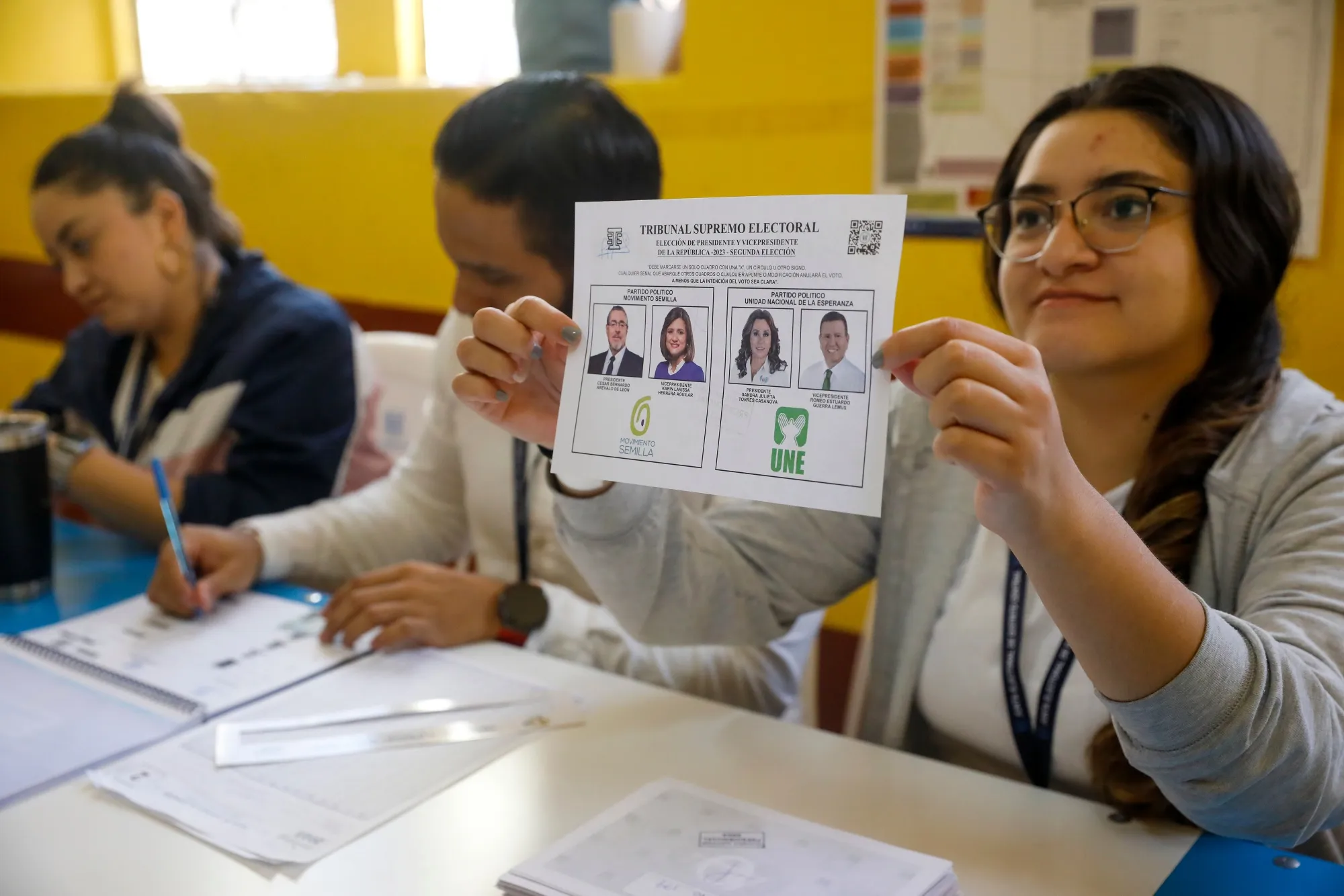 An electoral official displays a ballot at a polling station during the runoff presidential elections in Guatemala City, Guatemala, on&nbsp;Aug. 20.