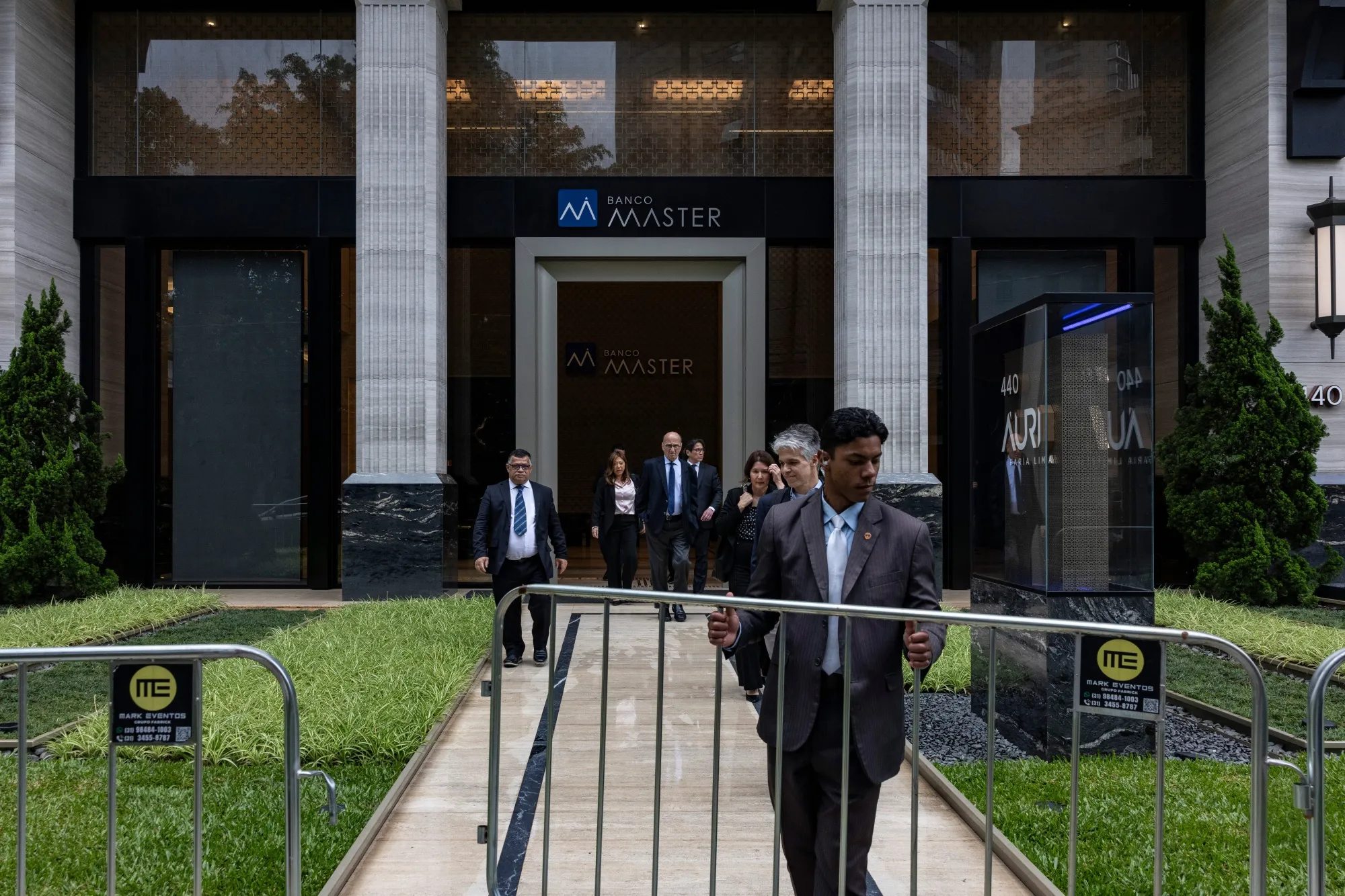 Employees of the Central Bank of Brazil leave the headquarters of Banco Master in Sao Paulo, Brazil, on Nov. 18.