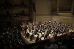 FILE — Andris Nelsons conducts a joint concert of the Boston Symphony Orchestra and Germany's visiting Leipzig Gewandhaus Orchestra on Oct. 31, 2019, at Symphony Hall in Boston. The Boston Symphony Orchestra is embarking on a four-city tour of Japan in November 2022, for its first overseas engagements since before the coronavirus pandemic forced the cancellation of cultural events around the world. (AP Photo/Elise Amendola, File)